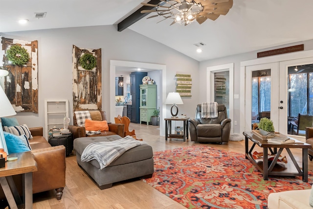 living room with ceiling fan, light wood-type flooring, french doors, and vaulted ceiling with beams