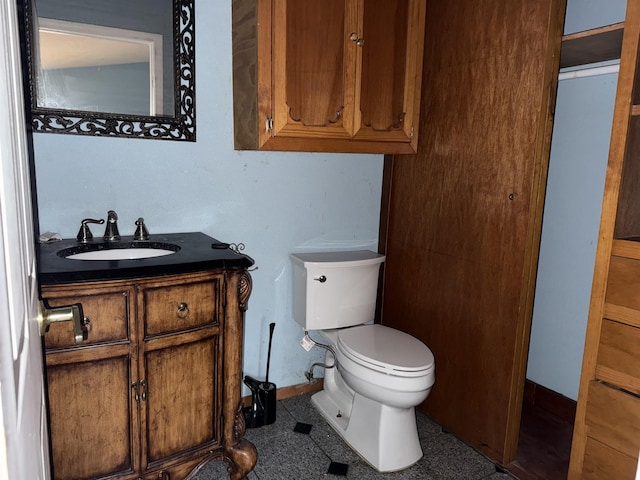 bathroom with toilet and vanity