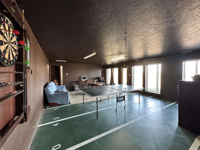 recreation room with concrete floors