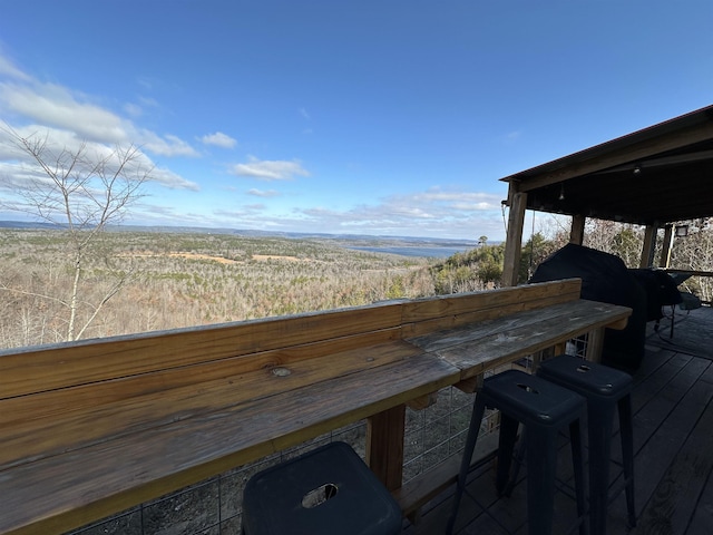 deck featuring exterior bar