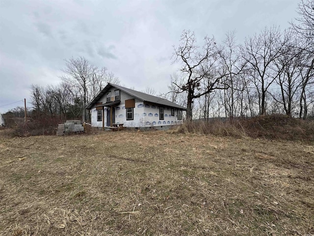 view of home's exterior with a yard