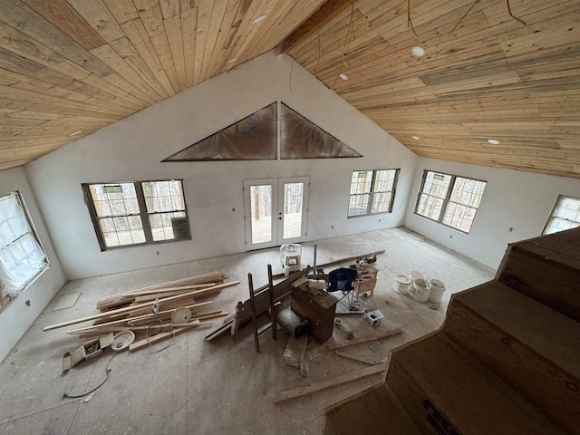 interior space featuring wood ceiling, beamed ceiling, high vaulted ceiling, and french doors