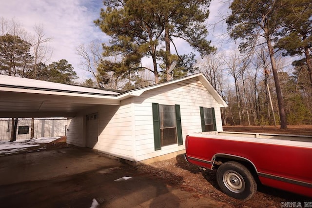 view of home's exterior featuring a carport