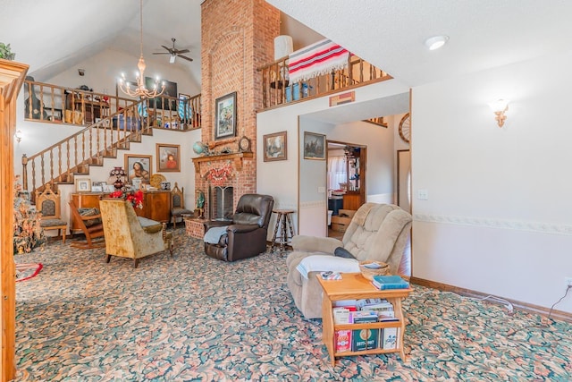 living room featuring a textured ceiling, a brick fireplace, high vaulted ceiling, and ceiling fan