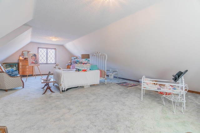 bedroom featuring a textured ceiling, carpet, and vaulted ceiling