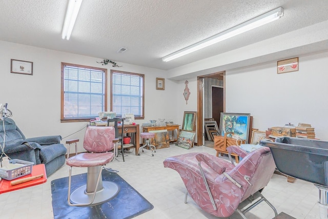 living room with a textured ceiling