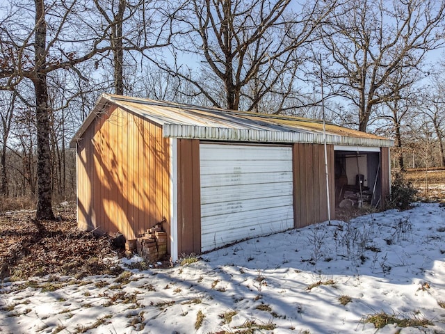 view of snow covered garage