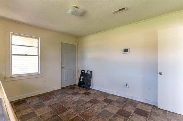 washroom with a textured ceiling