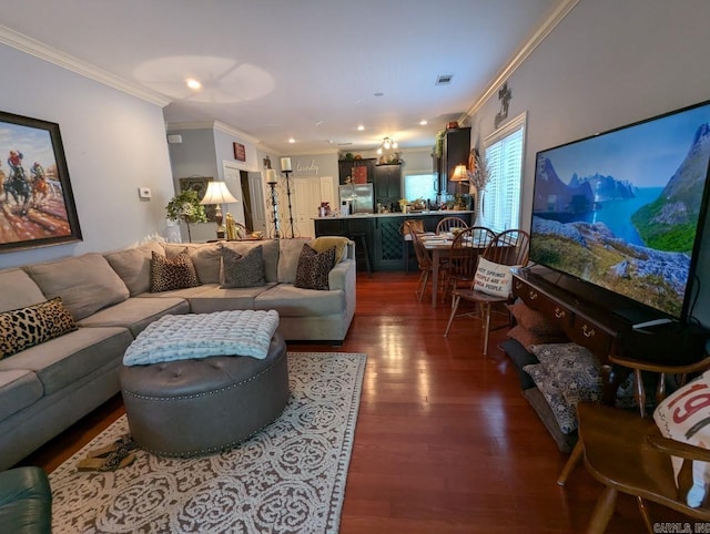 living room with ornamental molding and dark hardwood / wood-style floors