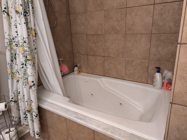 bathroom with shower / bath combo with shower curtain