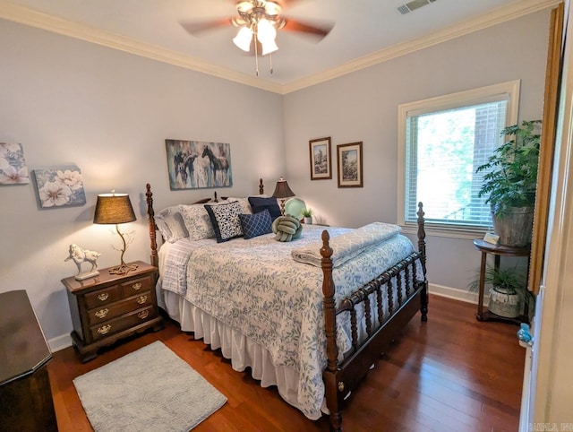 bedroom featuring ceiling fan, crown molding, and dark hardwood / wood-style floors