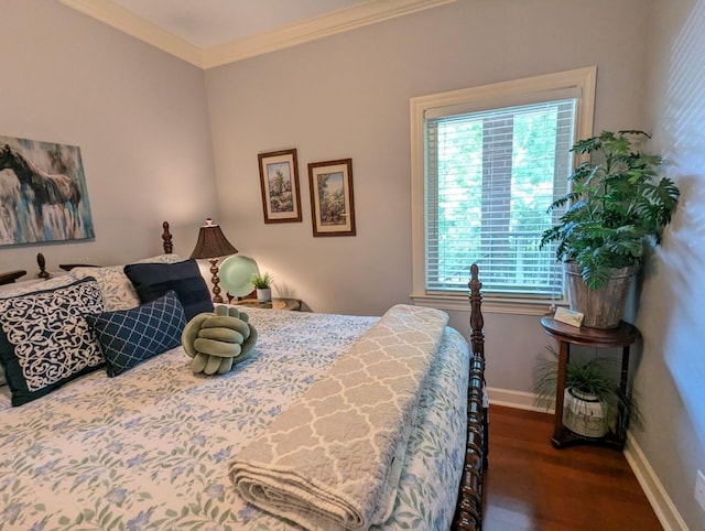 bedroom with dark hardwood / wood-style flooring, crown molding, and multiple windows