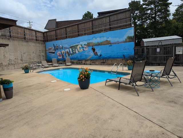 view of pool featuring a patio