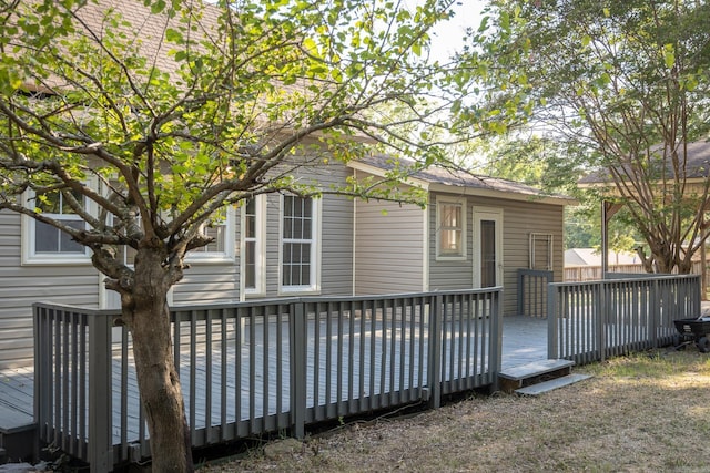 rear view of house with a wooden deck