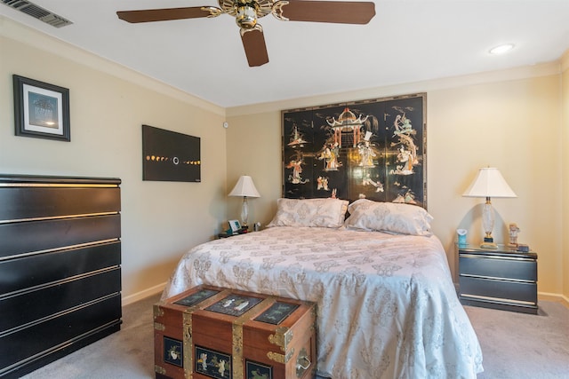 bedroom with ceiling fan, carpet, and ornamental molding