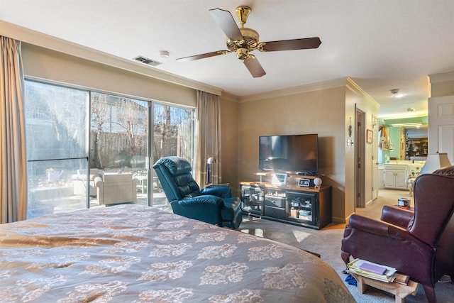 bedroom with light carpet, ceiling fan, ornamental molding, and connected bathroom