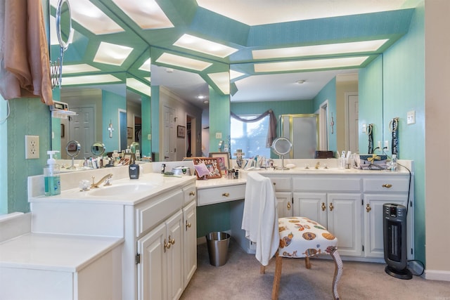 bathroom with a shower with shower door and vanity