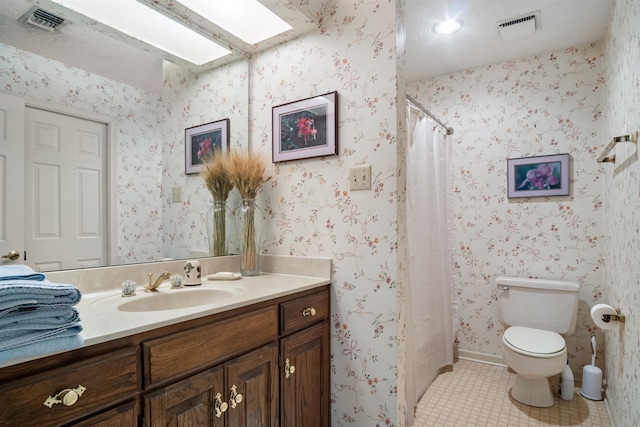 bathroom featuring a textured ceiling, tile patterned floors, vanity, toilet, and a shower with shower curtain