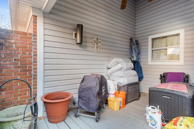 wooden deck featuring ceiling fan