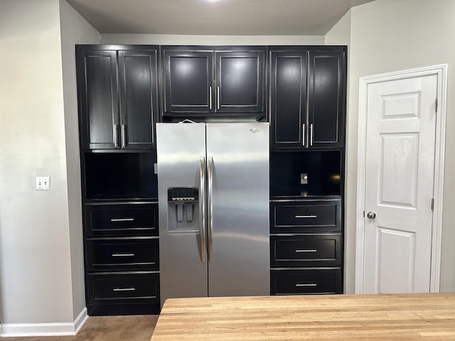 kitchen featuring stainless steel fridge