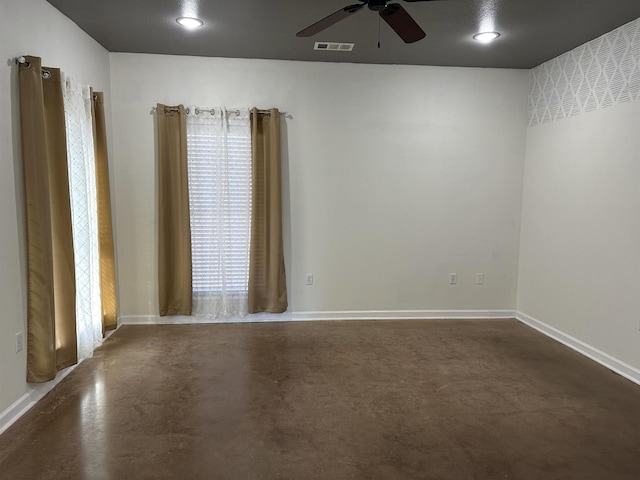 spare room with ceiling fan