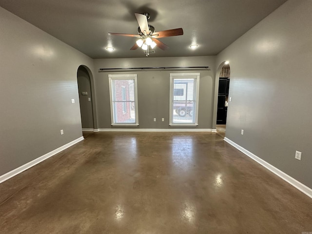 unfurnished room with ceiling fan