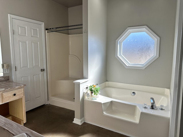 bathroom with vanity and separate shower and tub