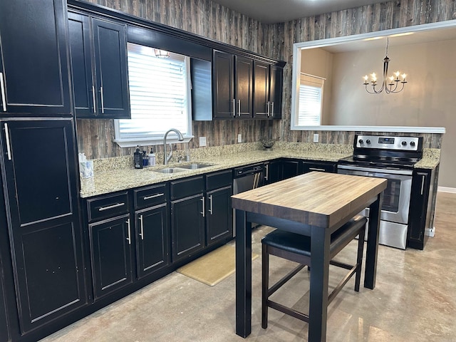 kitchen featuring light stone countertops, decorative light fixtures, sink, a notable chandelier, and electric range