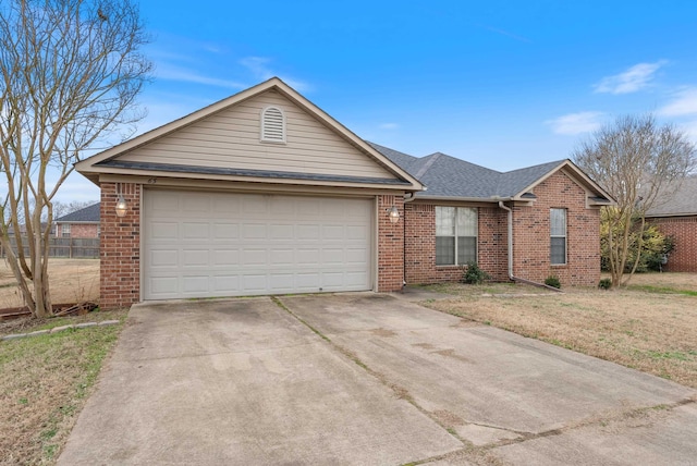 single story home with a front yard and a garage