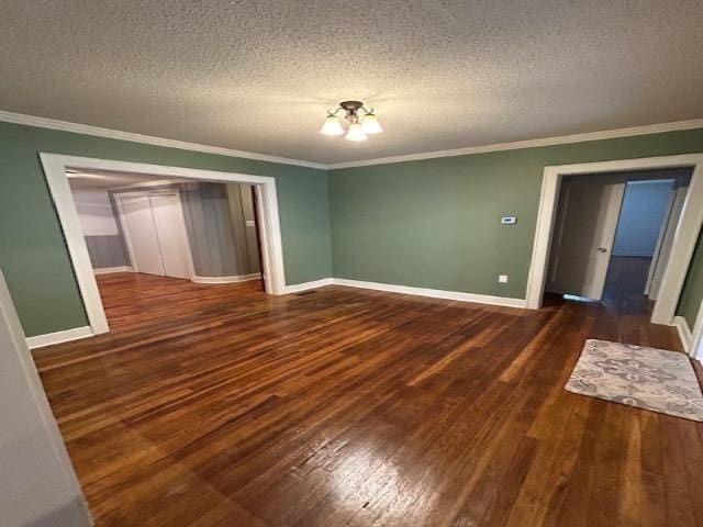 unfurnished bedroom with a closet, a notable chandelier, crown molding, and a textured ceiling