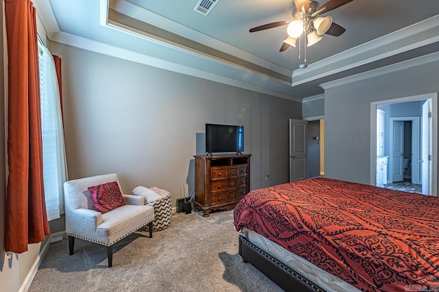 bedroom featuring ceiling fan, carpet, a tray ceiling, and connected bathroom