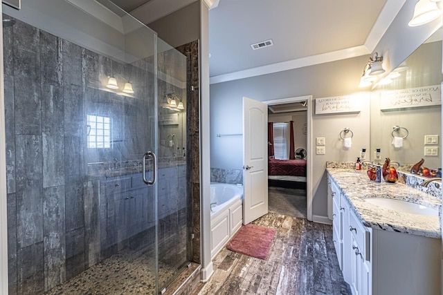 bathroom with vanity, ornamental molding, plus walk in shower, and hardwood / wood-style floors