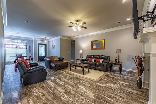 living room with ceiling fan, dark hardwood / wood-style flooring, and crown molding