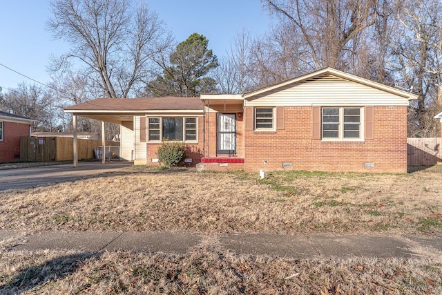 single story home featuring a carport