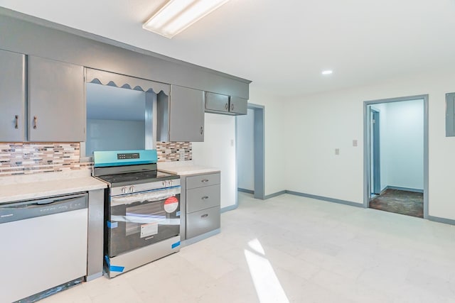 kitchen featuring decorative backsplash, appliances with stainless steel finishes, and gray cabinetry