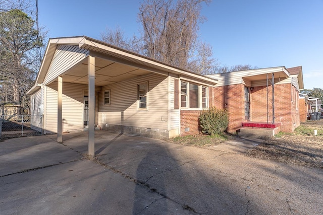 view of property exterior featuring a carport