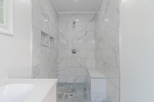 bathroom featuring tiled shower