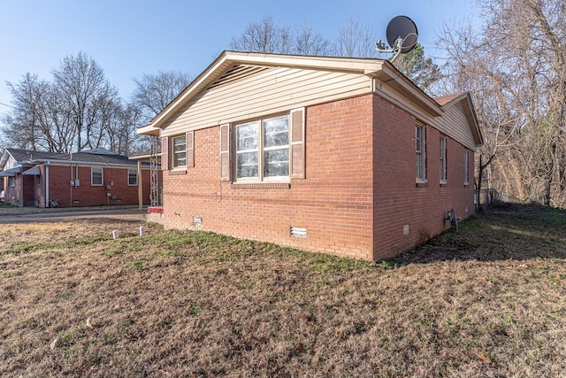 view of property exterior with a lawn