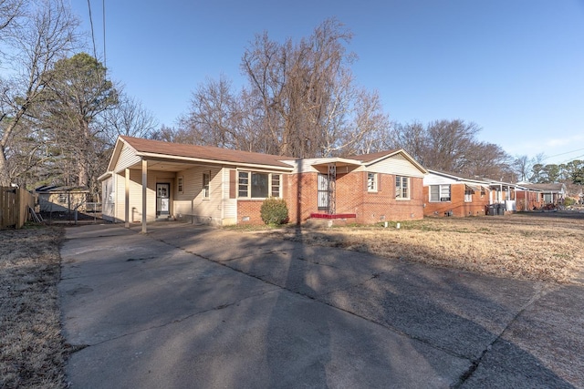 ranch-style house featuring a carport