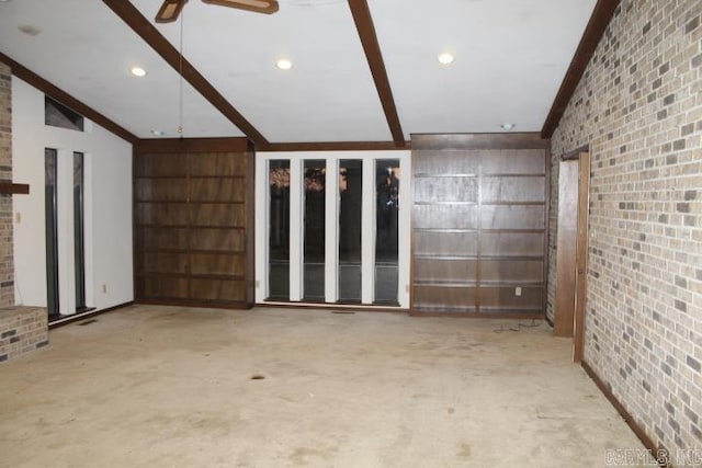 unfurnished living room featuring ceiling fan and vaulted ceiling