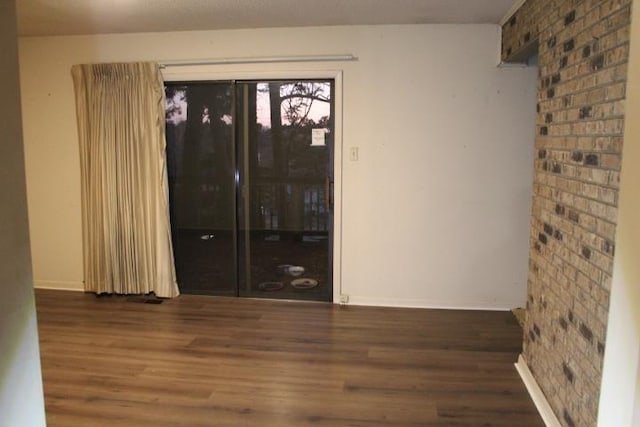 unfurnished room with dark hardwood / wood-style floors