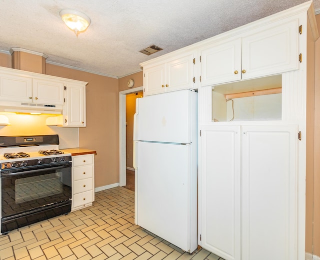 kitchen featuring a textured ceiling, white cabinetry, white refrigerator, ornamental molding, and gas range oven