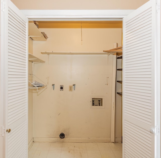 clothes washing area featuring hookup for a washing machine and electric dryer hookup