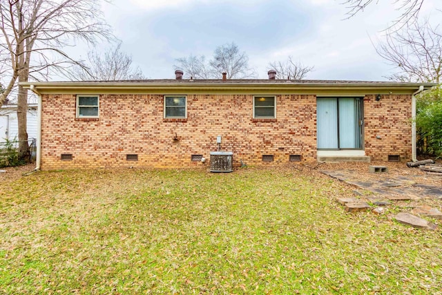 back of house with a yard