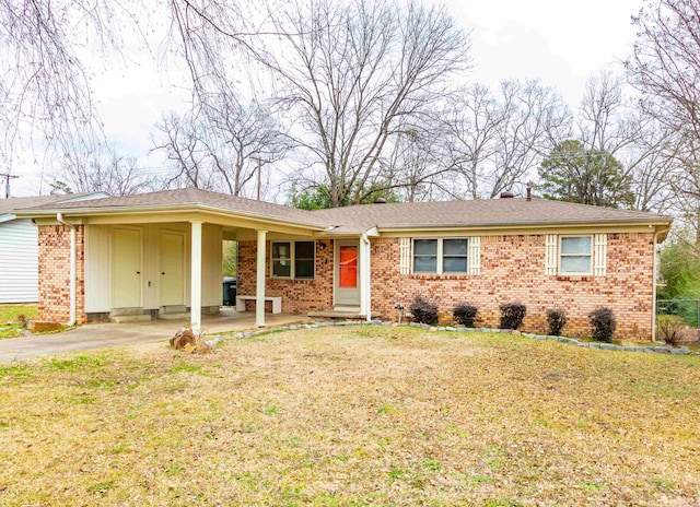 ranch-style home with a front lawn and a carport