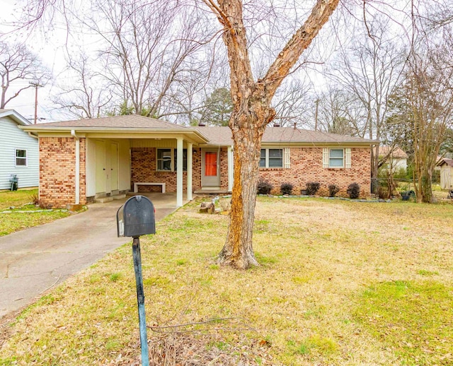 ranch-style house with a front lawn and a carport