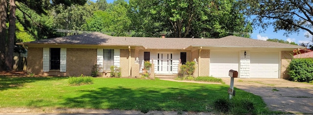 ranch-style house with a garage and a front yard