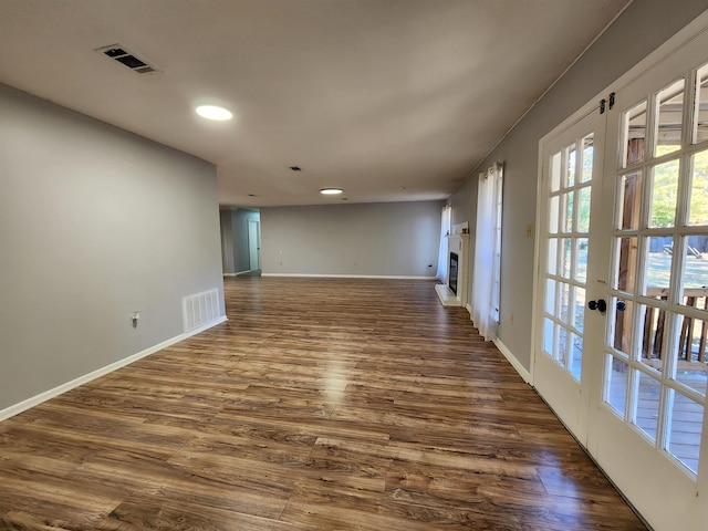 unfurnished room with dark hardwood / wood-style floors