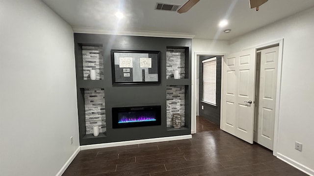 unfurnished living room with ceiling fan and dark hardwood / wood-style floors