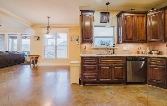 kitchen with sink, pendant lighting, dishwasher, and crown molding